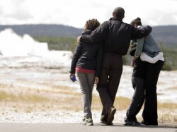 The Obama family admires Old Faithful on August 15, 2009